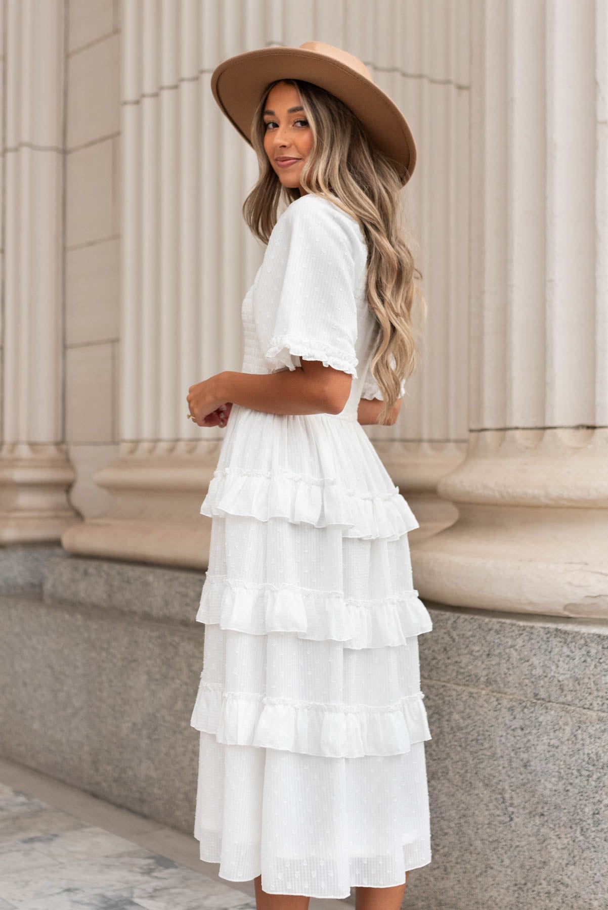 Side view of the white tiered textured dress