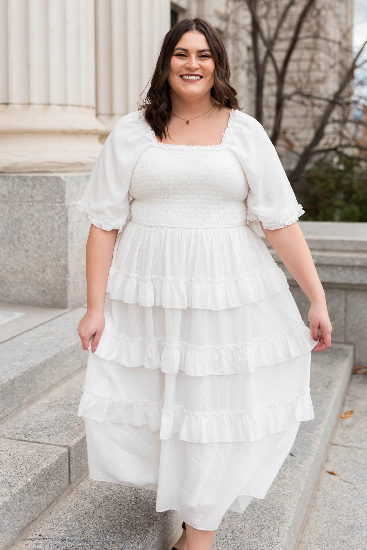 Plus size white tiered textured dress with ruffles on the skirt