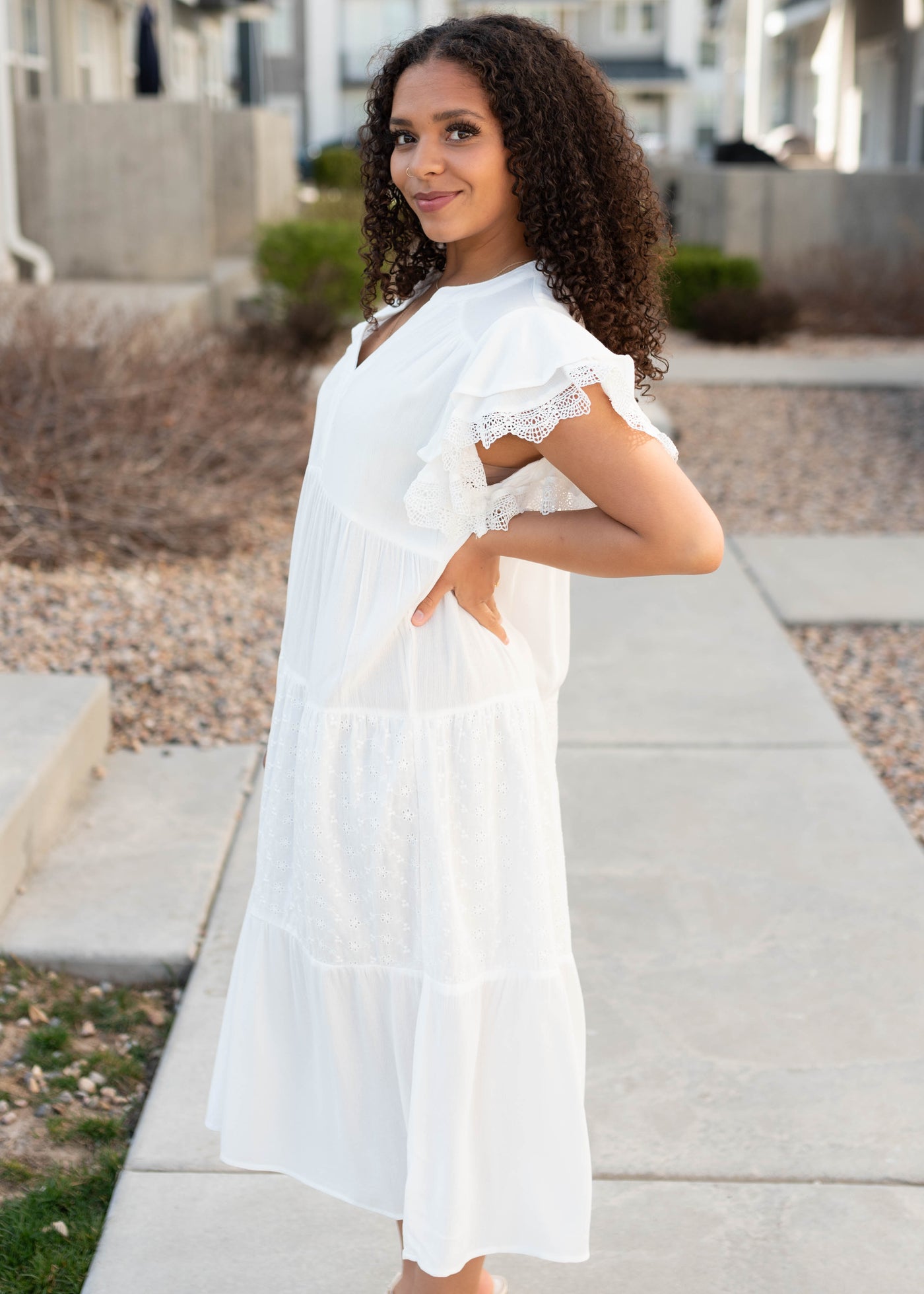 Side view ofthe white ruffle sleeve dress