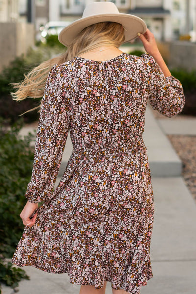 Back view of a brown floral dress