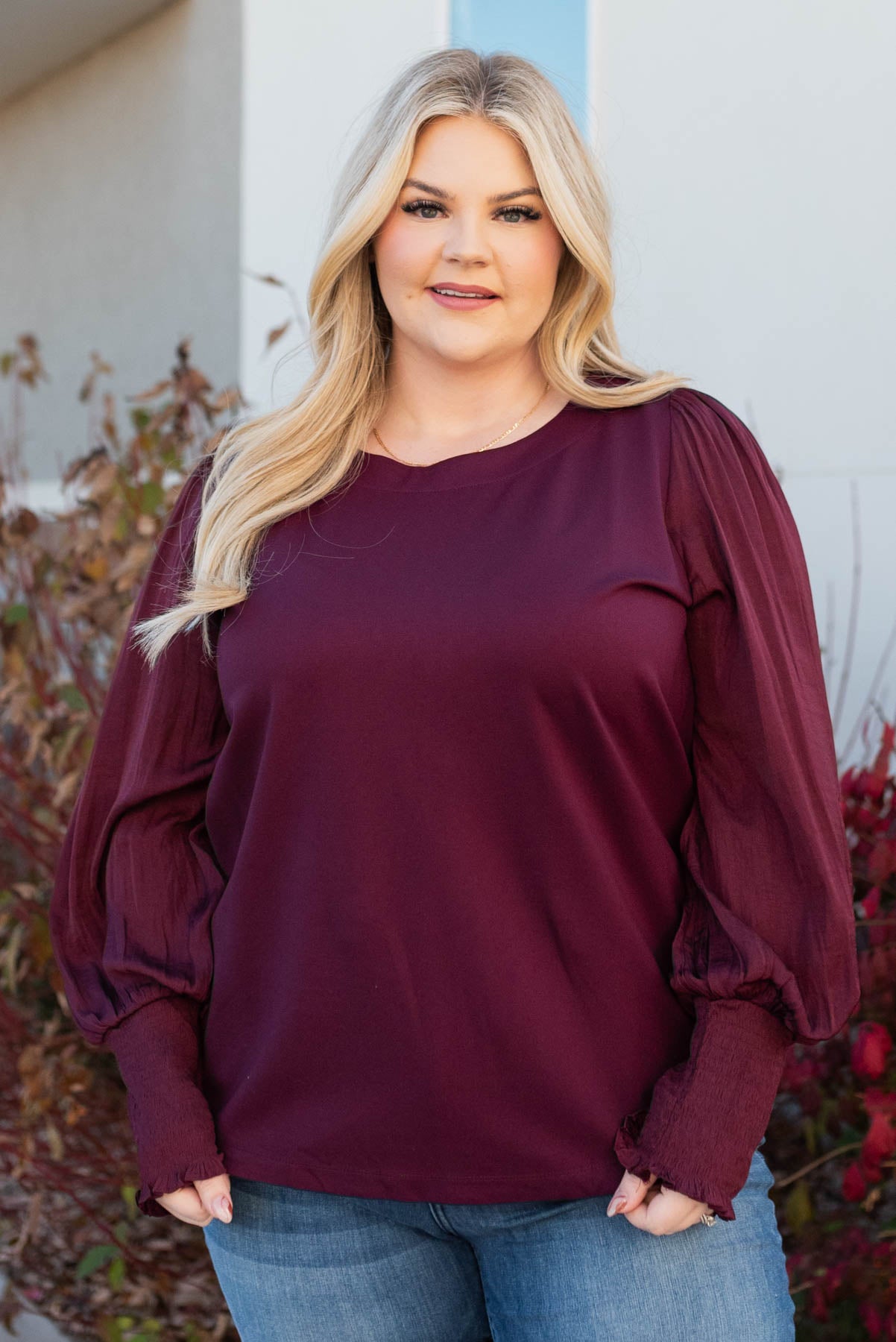 Front view of a plus size wine satin sleeve blouse