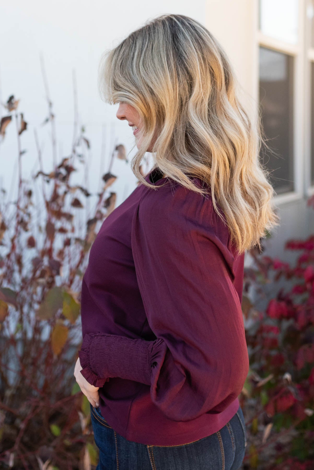 Side view of the wine satin sleeve blouse