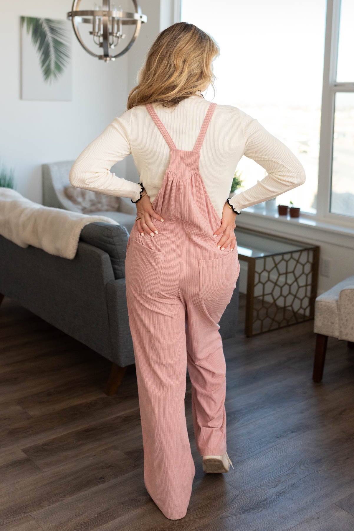 Back view of dusty pink overalls