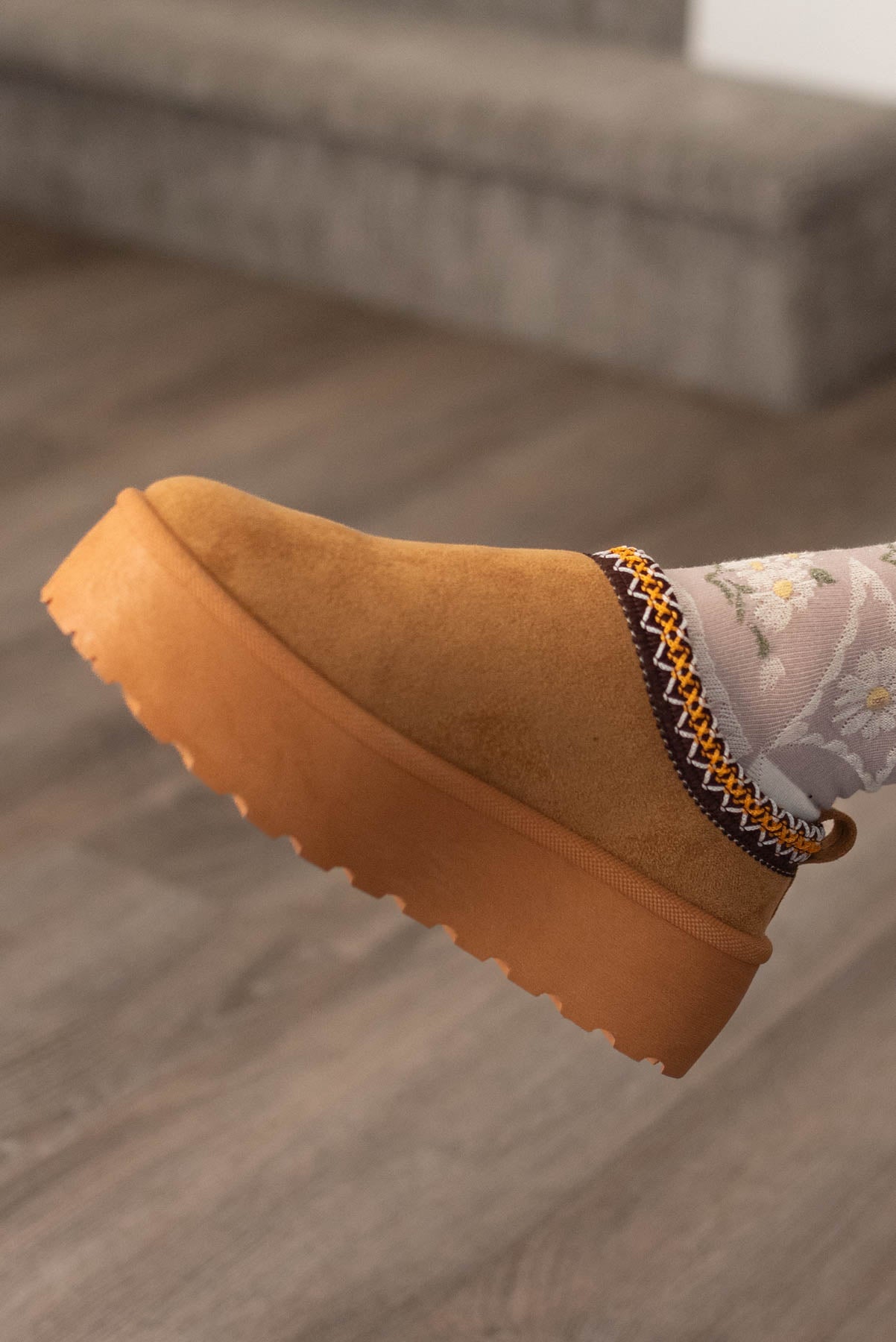 Side view of camel slip-on clogs