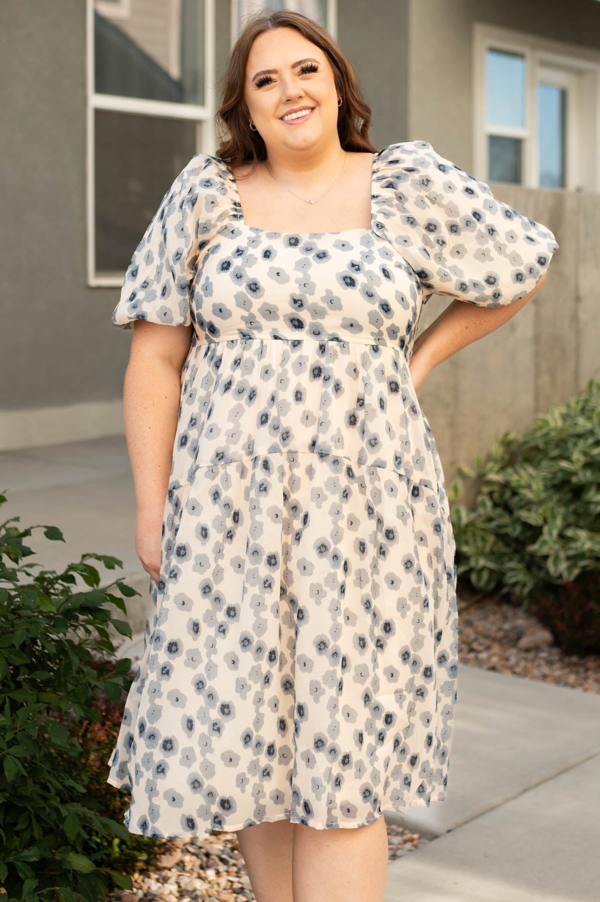 Plus size blue dress with square neck, short sleeves and floral print