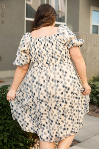 Back view of plus size blue dress with floral print