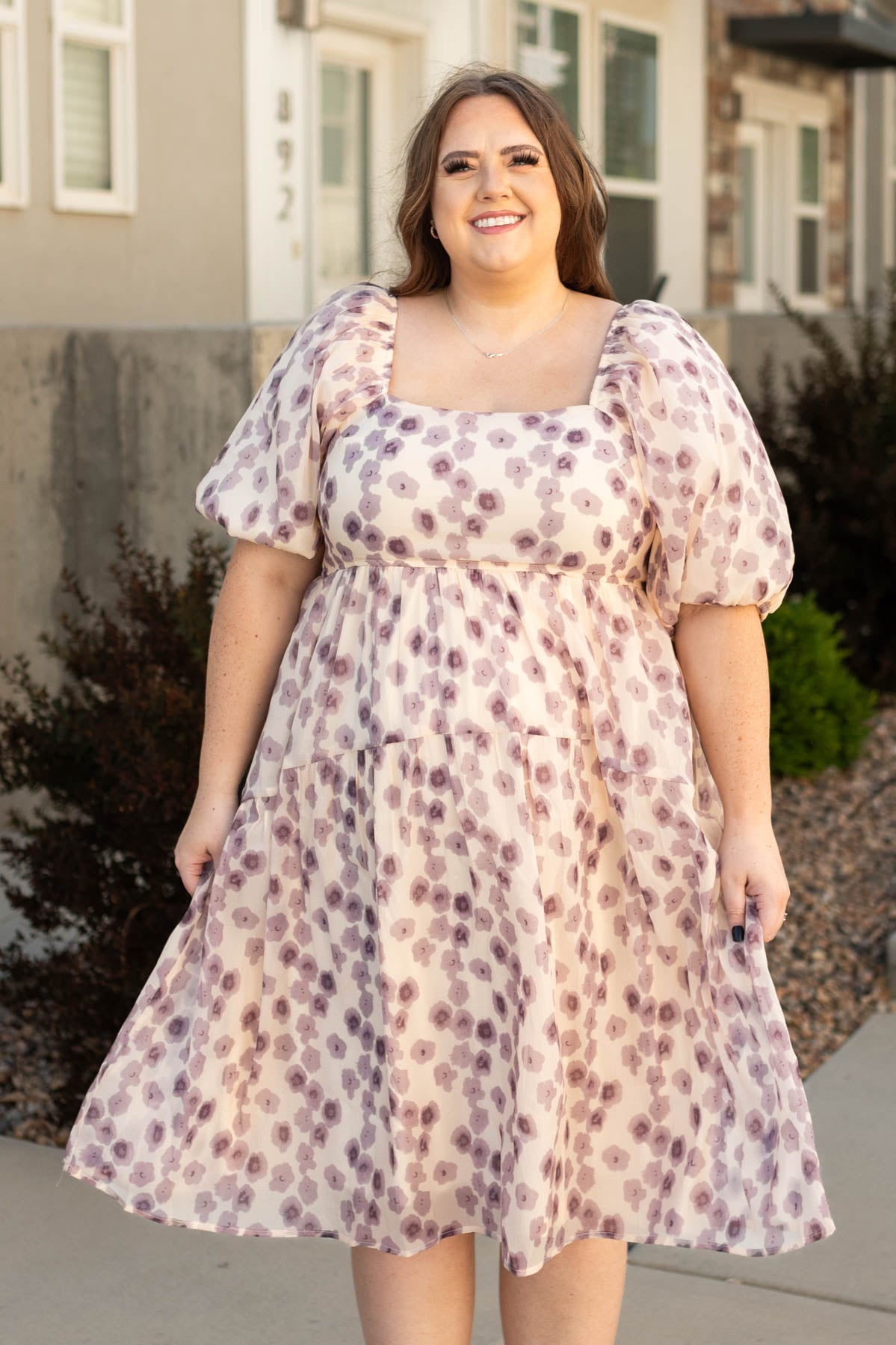 Plus size lavender dress with a square neck, short sleeves and floral print