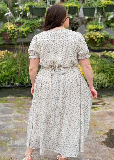 Back view of the blue floral smocked dress in plus size