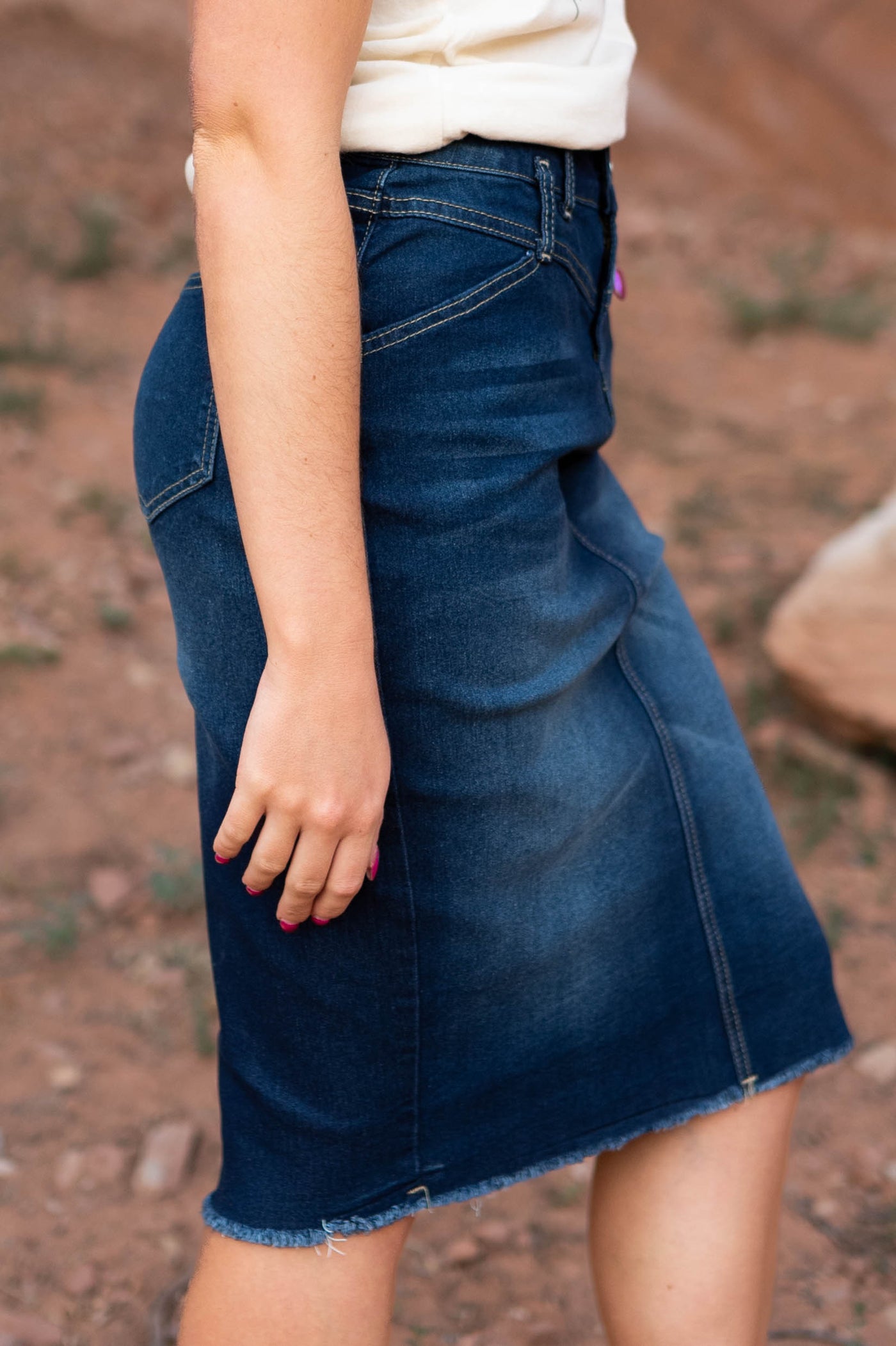 Side view of a dark indigo skirt