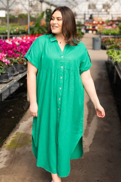 Plus size green button down dress with short sleeves and a collar