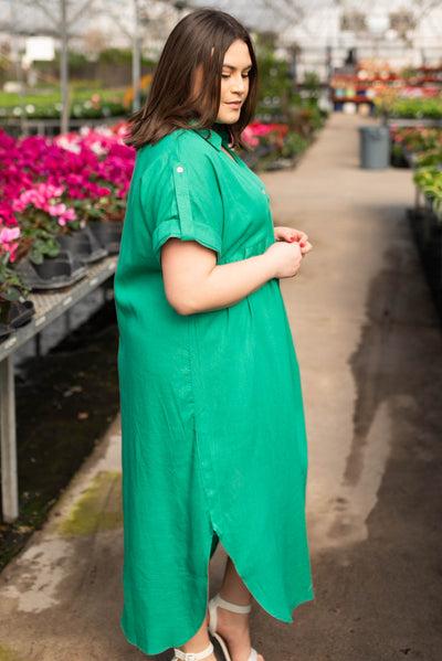 Side view of the plus size green button down dress