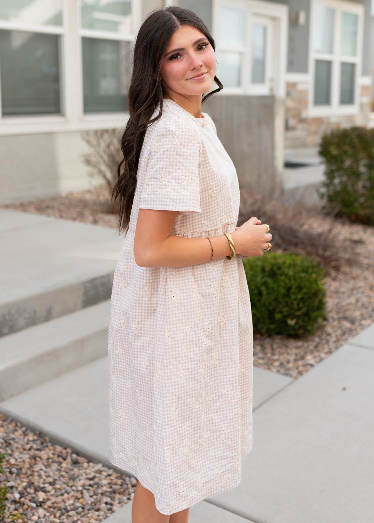 Side view of the the embroidered gingham mini dress