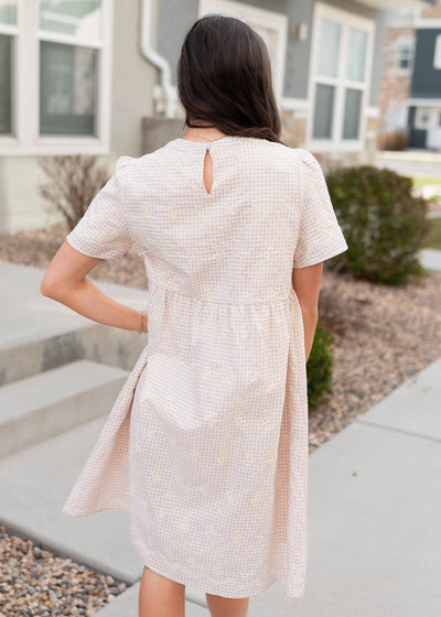 Back view of the embroidered gingham mini dress