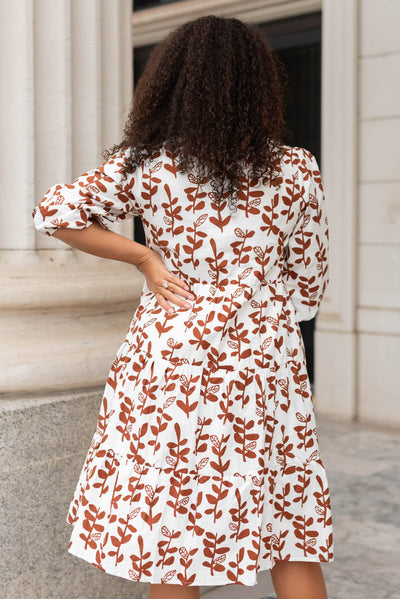 Back view of a brown floral dress