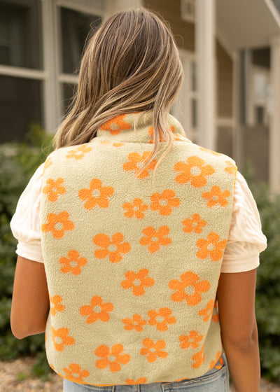 Back view of a orange fleece vest