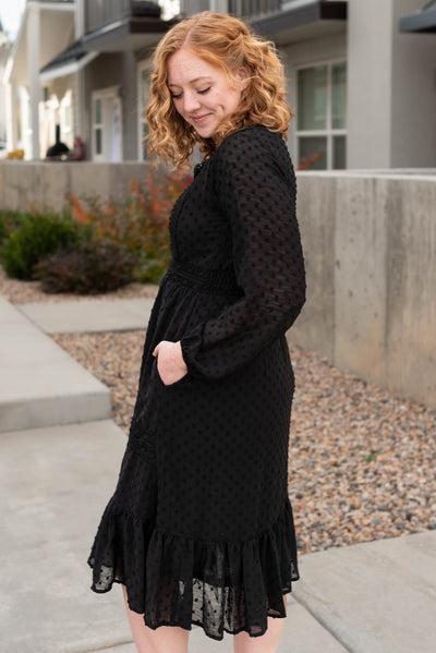 Side view of the black textured dress