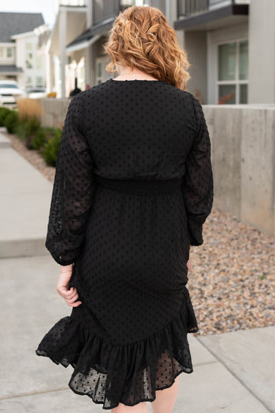 Back view of the black textured dress