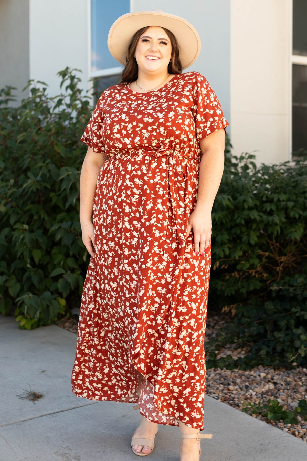 Front view of a plus size rust floral dress