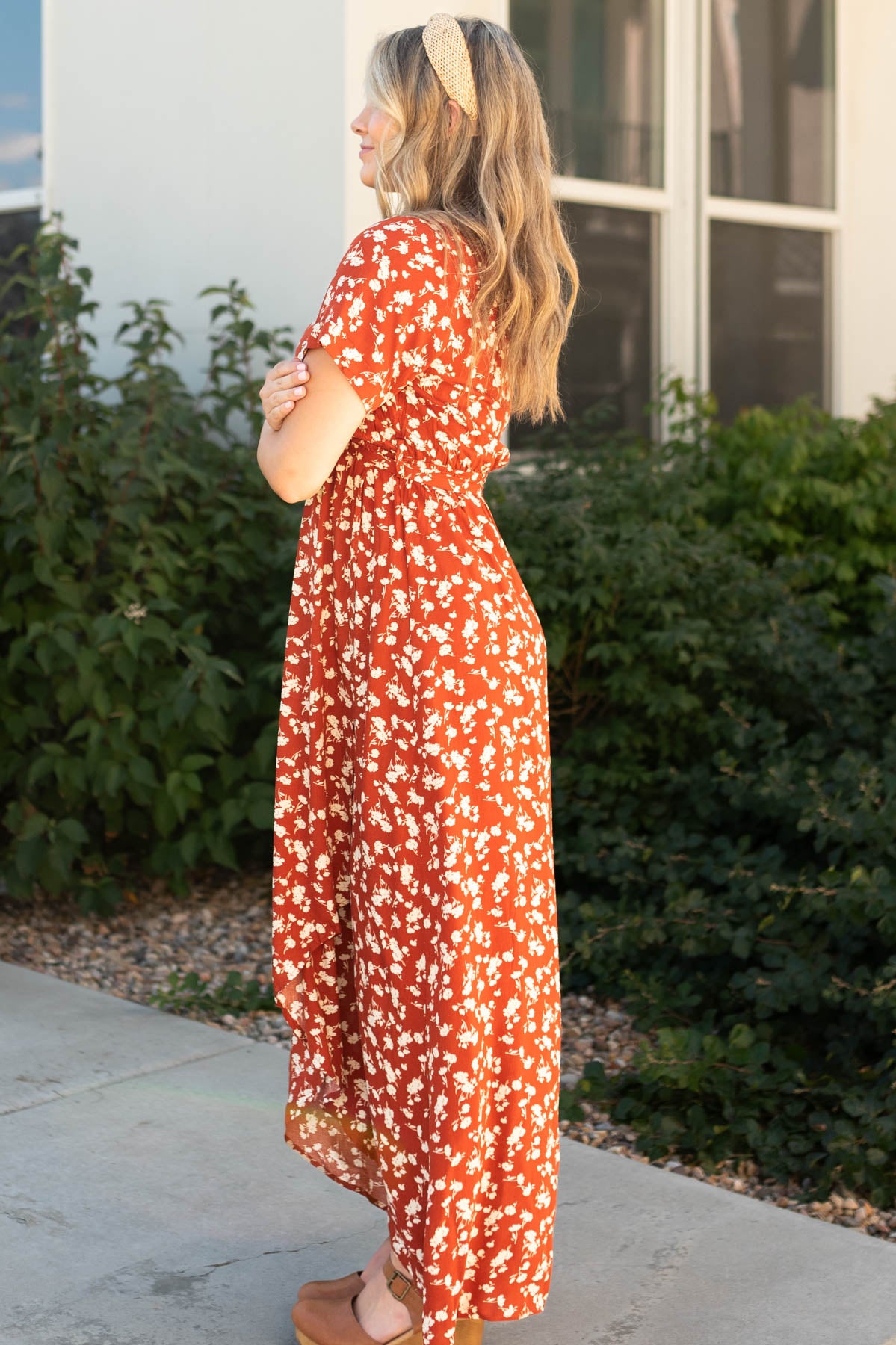 Side view of a rust floral dress