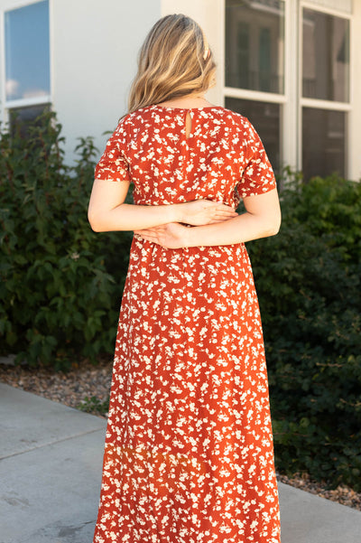 Back view of a rust floral dress