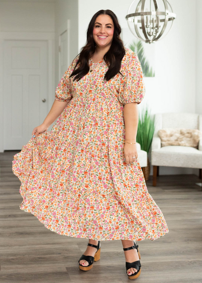 Plus size apricot floral dress with short sleeve and tiered skirt