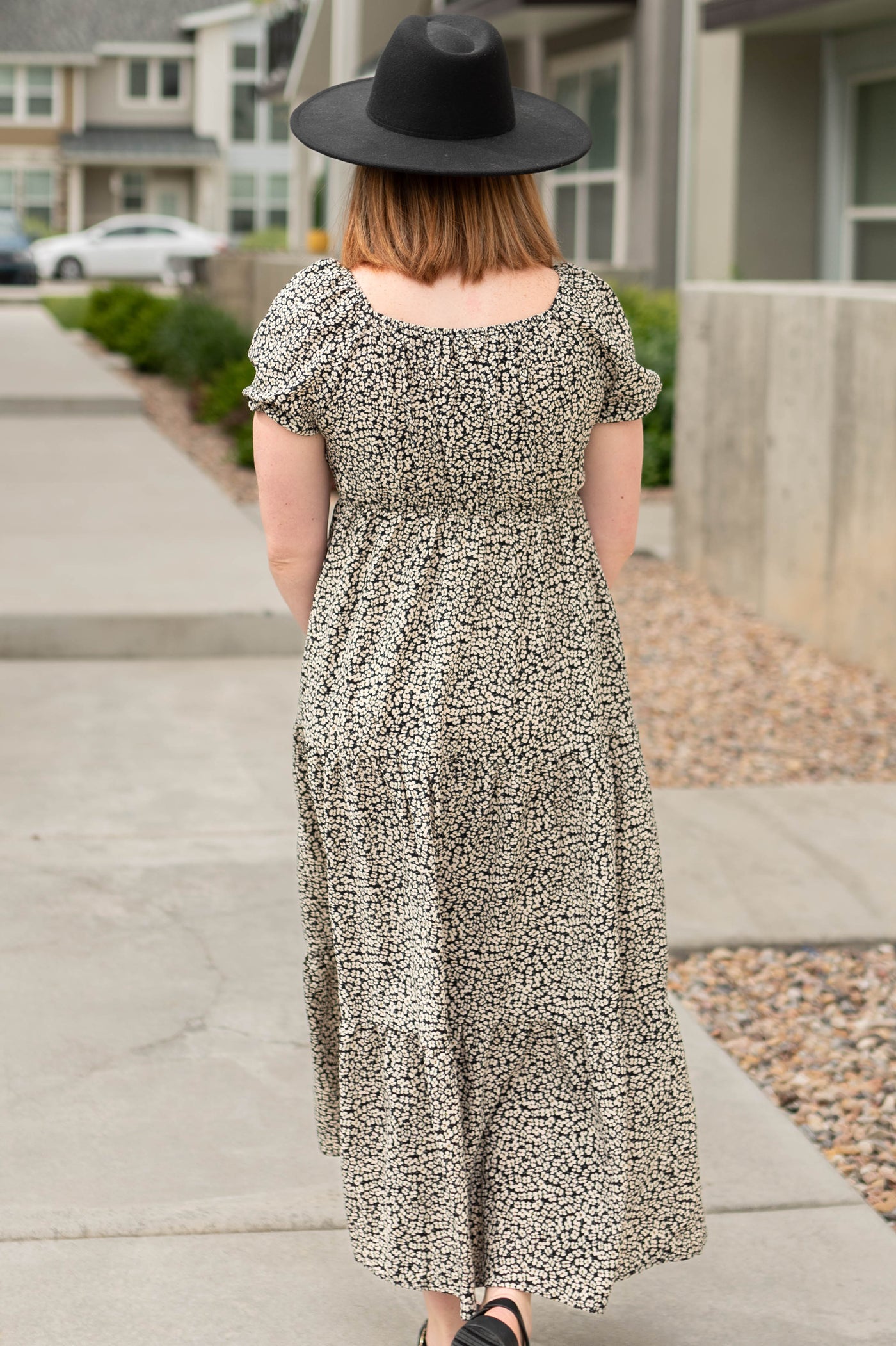 Back view of a black floral dress