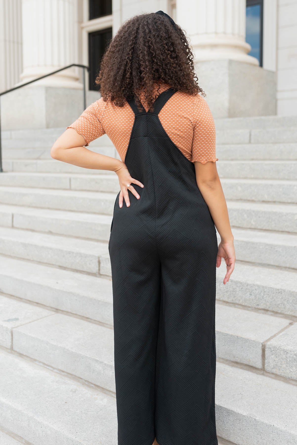 Back view of the black textured overalls