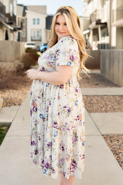 Side view of the plus size grey floral dress