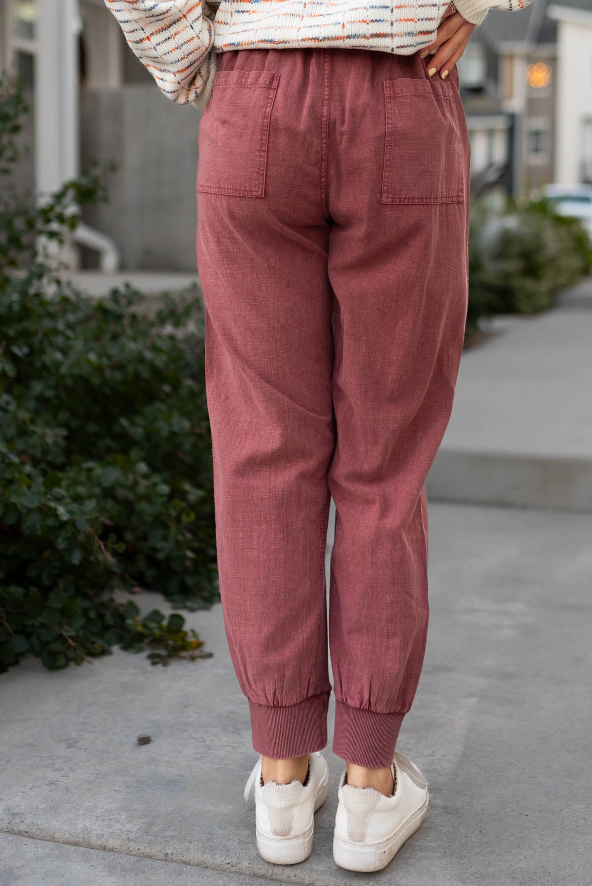 Back view of faded plum joggers with back pockets