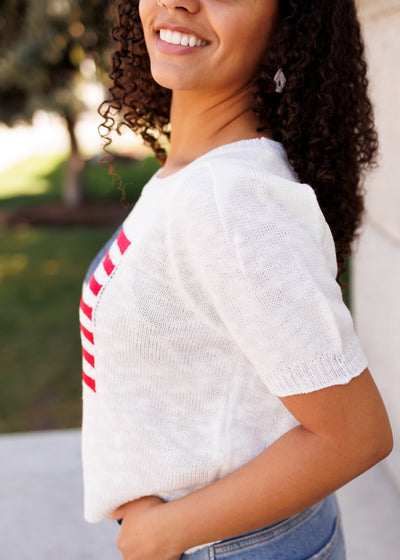 Side view of the ivory flag sweater top
