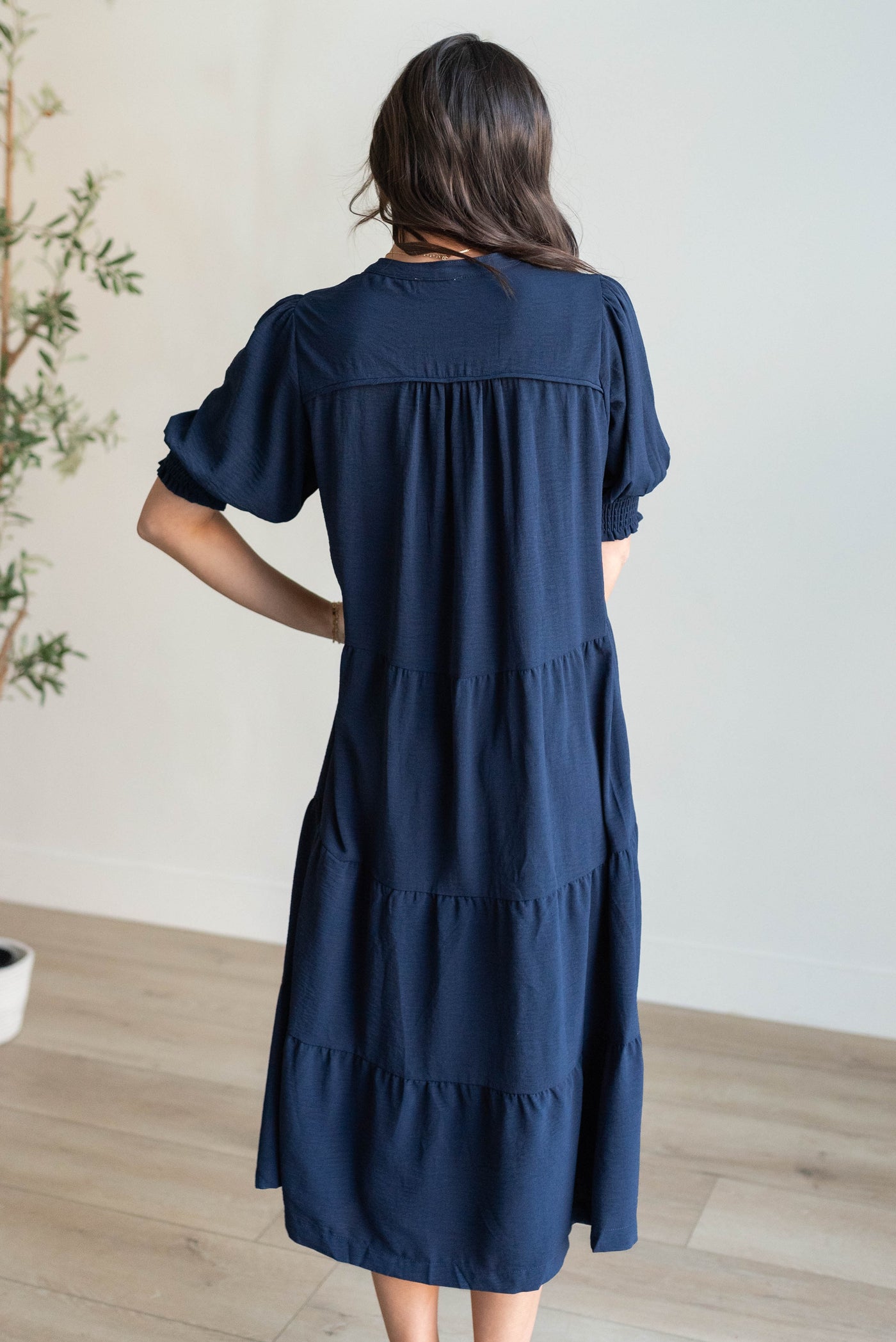 Back view of the navy tiered dress