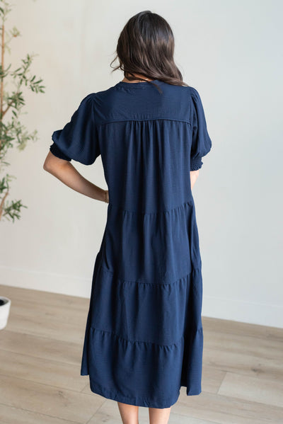Back view of the navy tiered dress