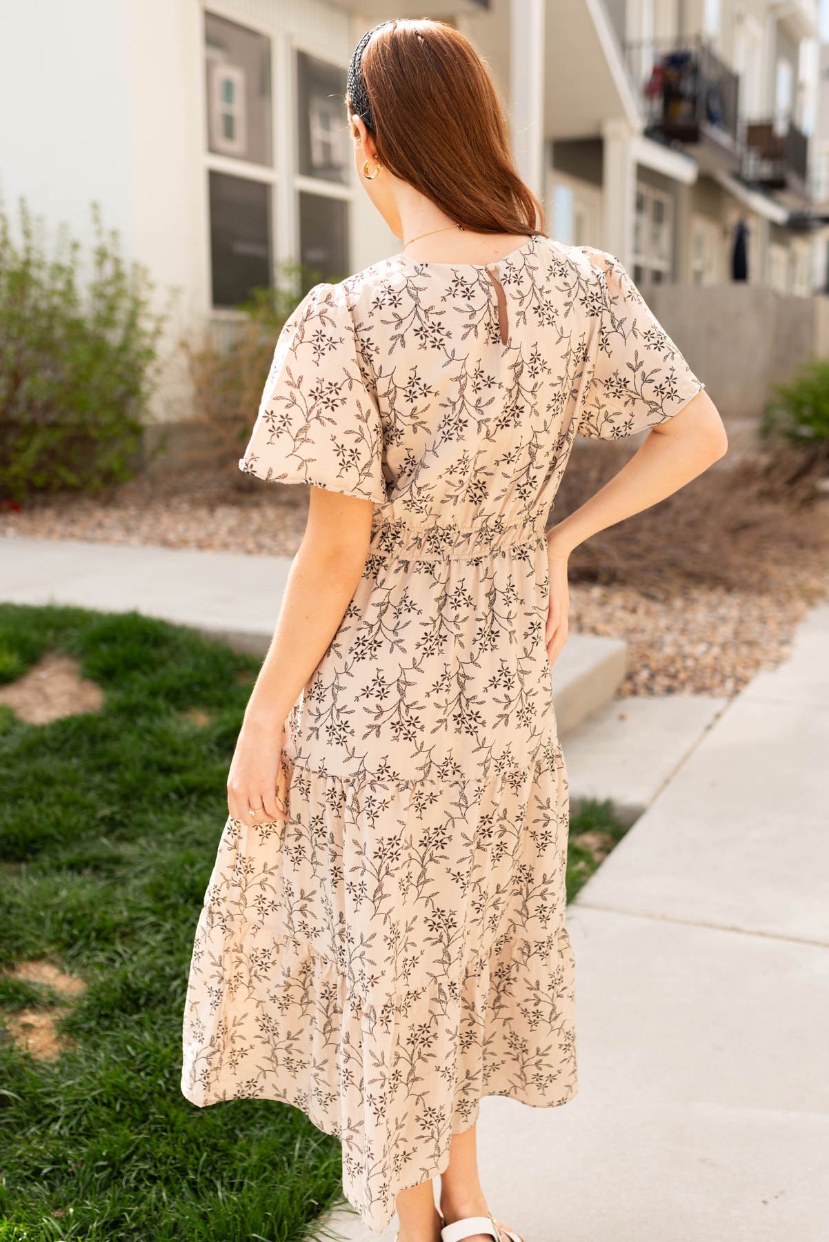 Back view of the taupe patterned dress