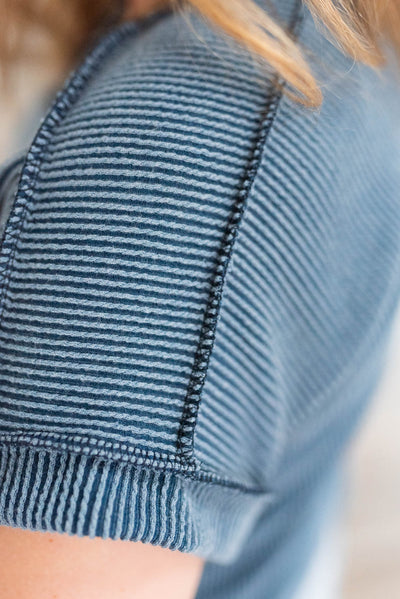 Close up of the fabric on the plus size navy ribbed top