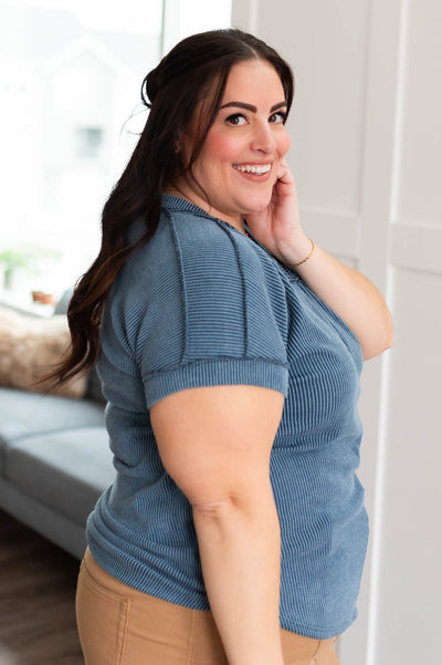 Side view of the plus size navy ribbed top