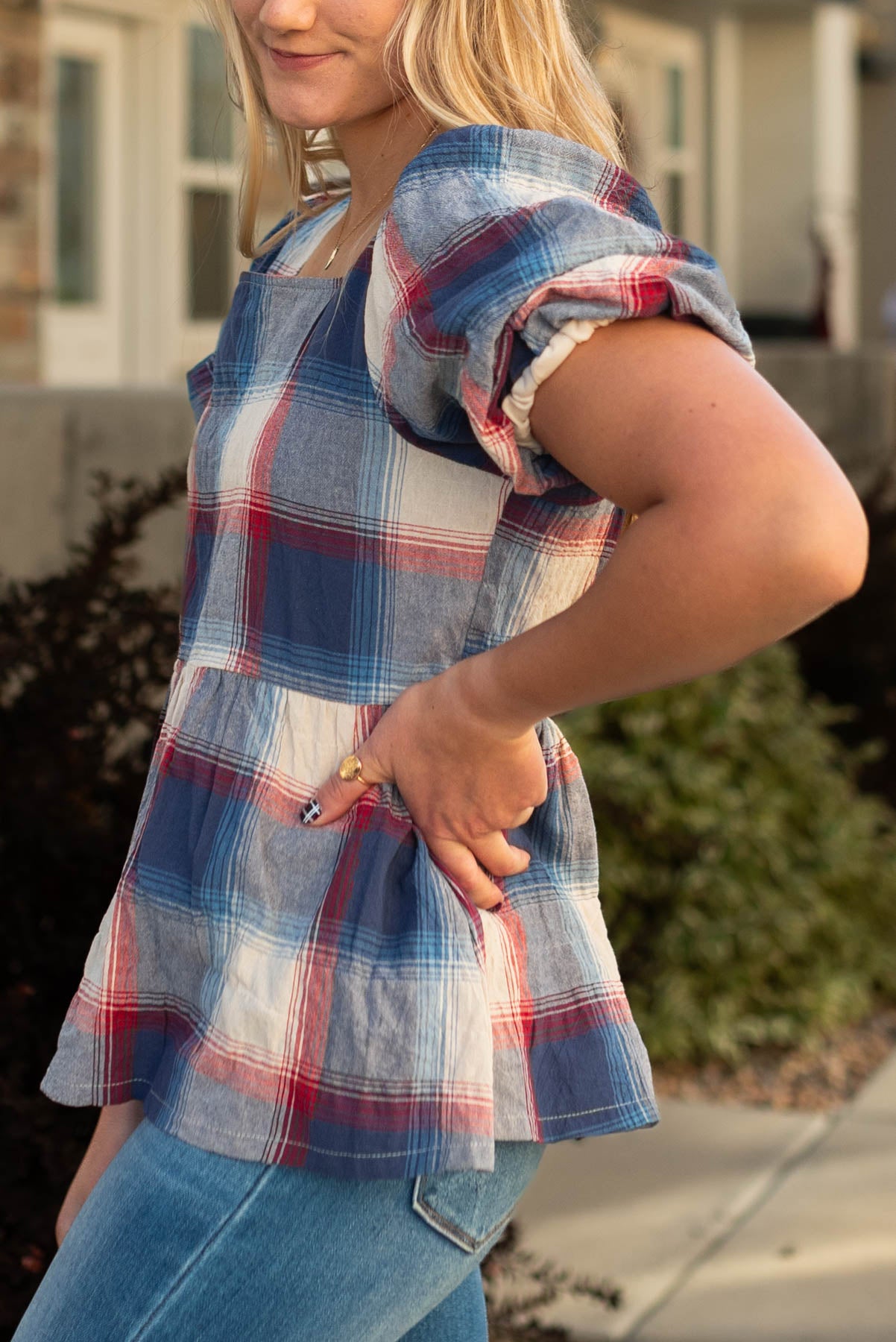 Side view of a navy plaid top