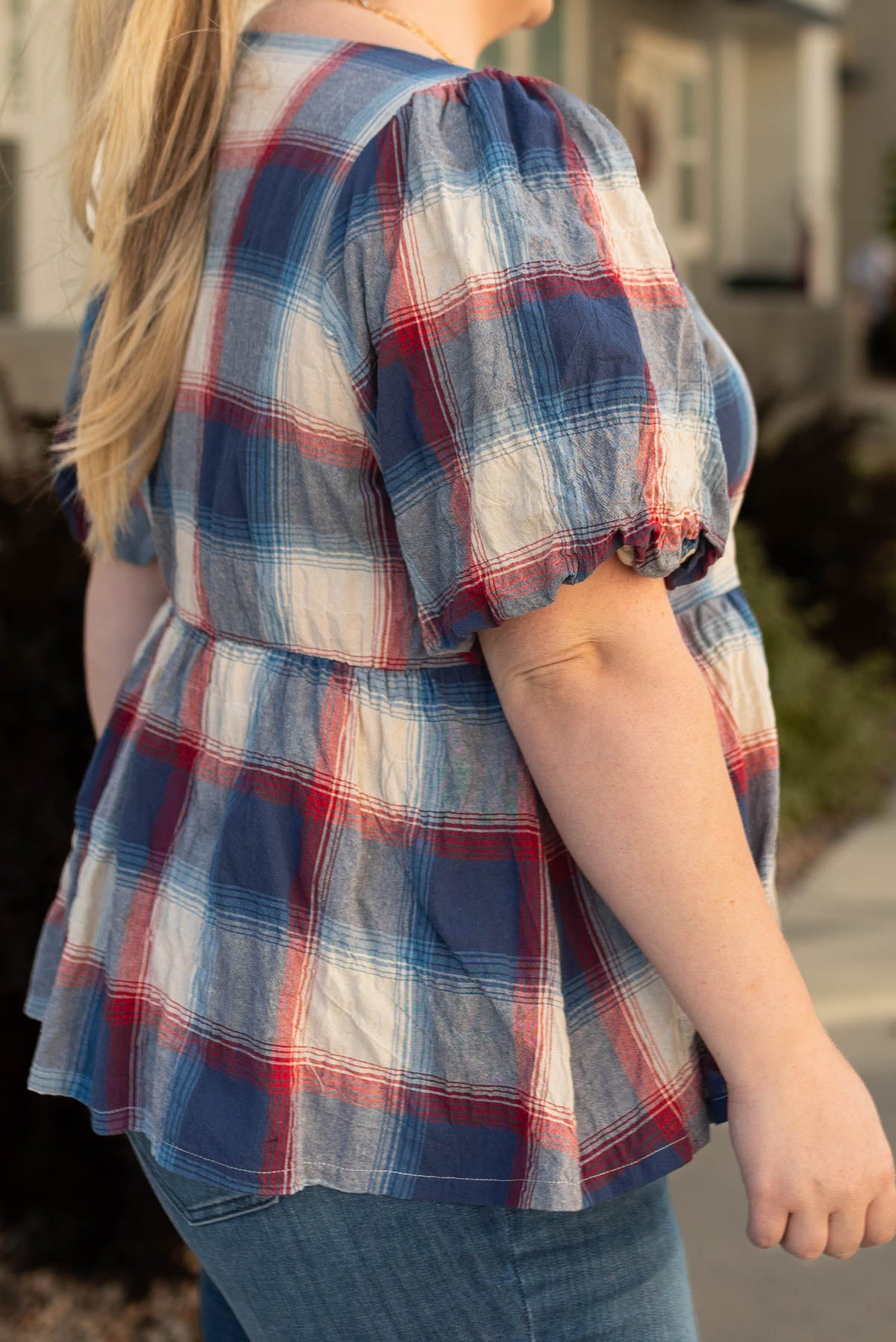 Side view of the plus size Lilly navy plaid top