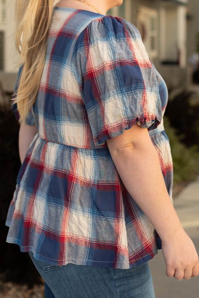 Side view of the plus size Lilly navy plaid top