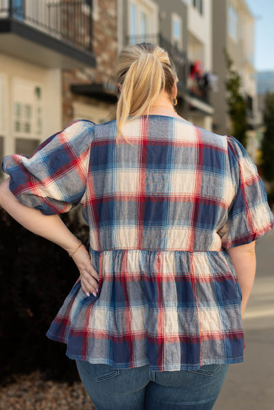 Back view of the plus size navy plaid top
