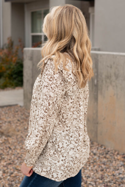 Side view of the taupe pattern blouse