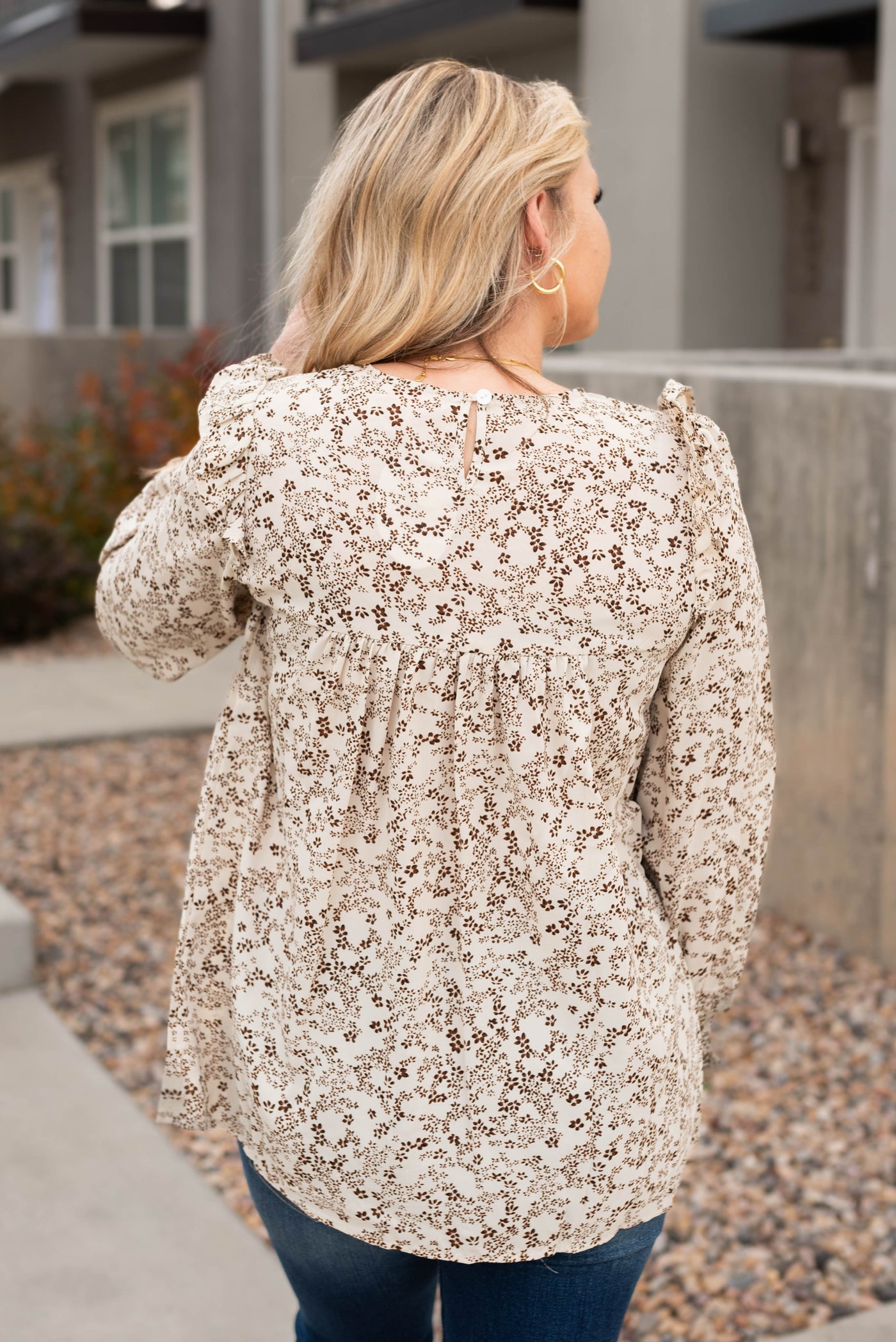 Back view of the taupe pattern blouse