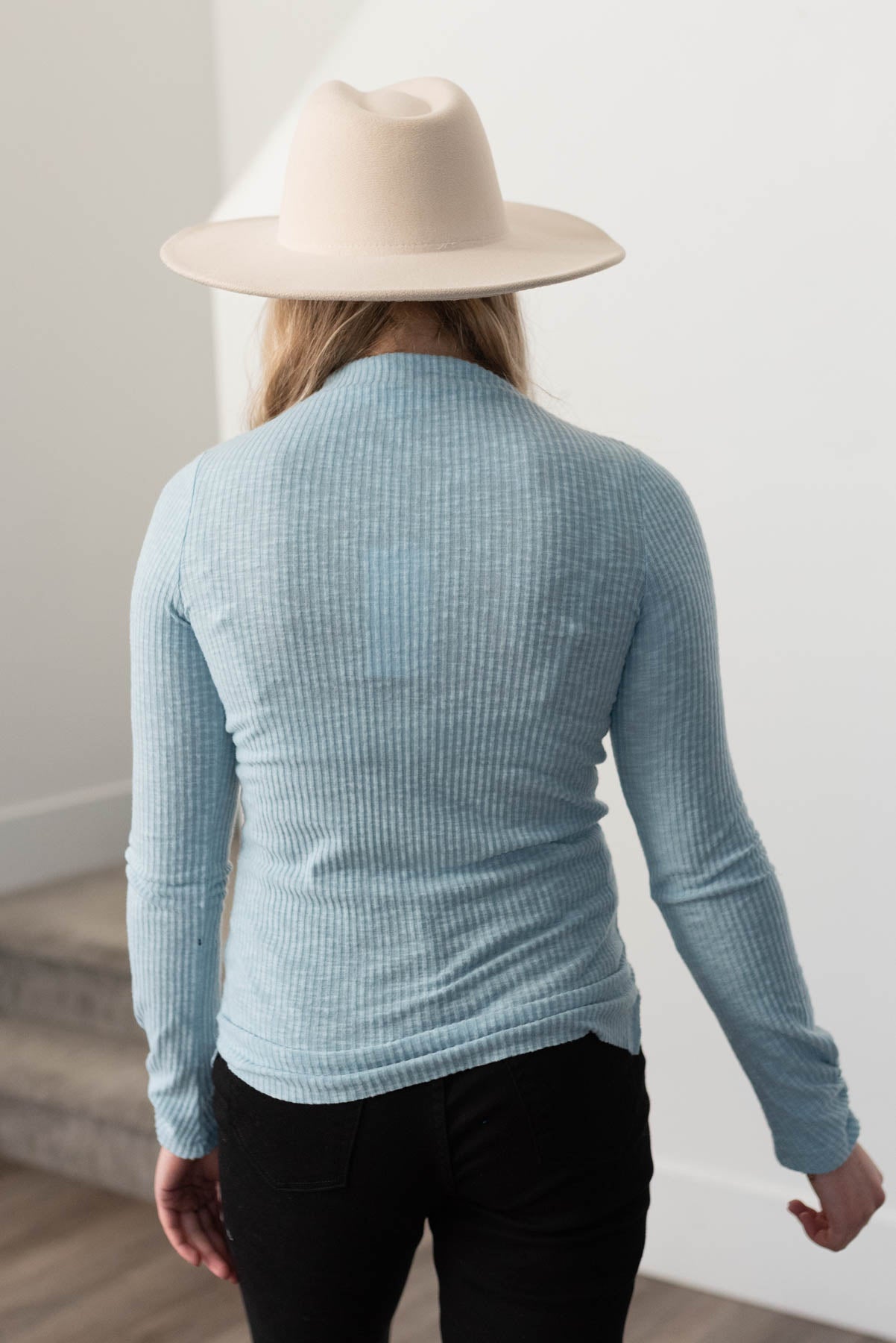 Back view of a sky blue top