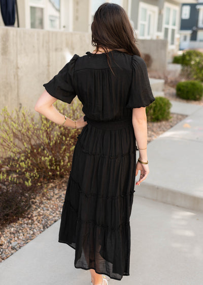 Back view of the black puff sleeve dress