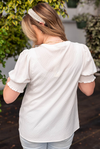 Back view of the off white puff sleeve top