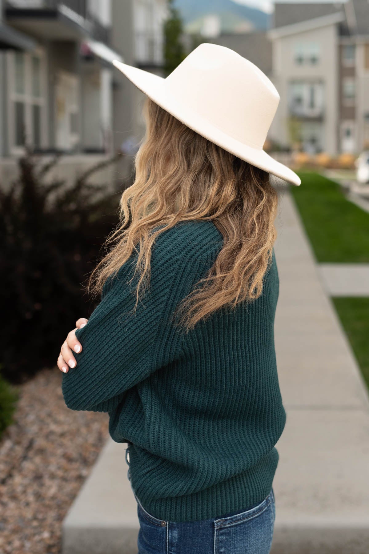 Side view of a evergreen sweater