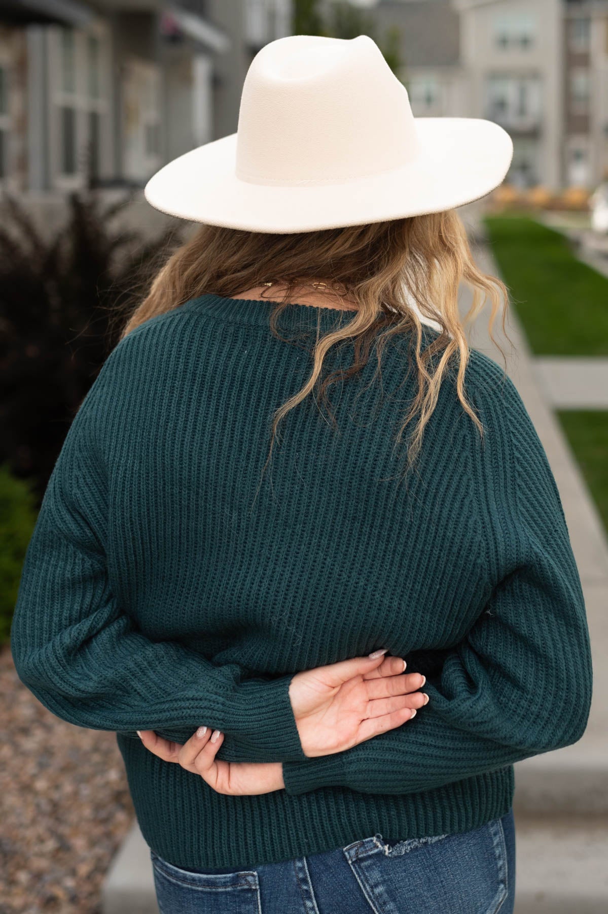 Back view of a evergreen sweater