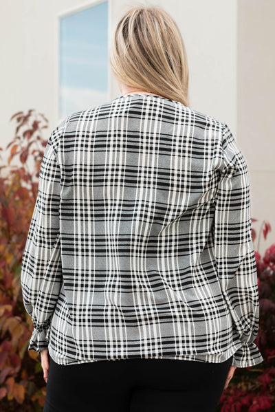 Back view of the plus size black plaid blouse