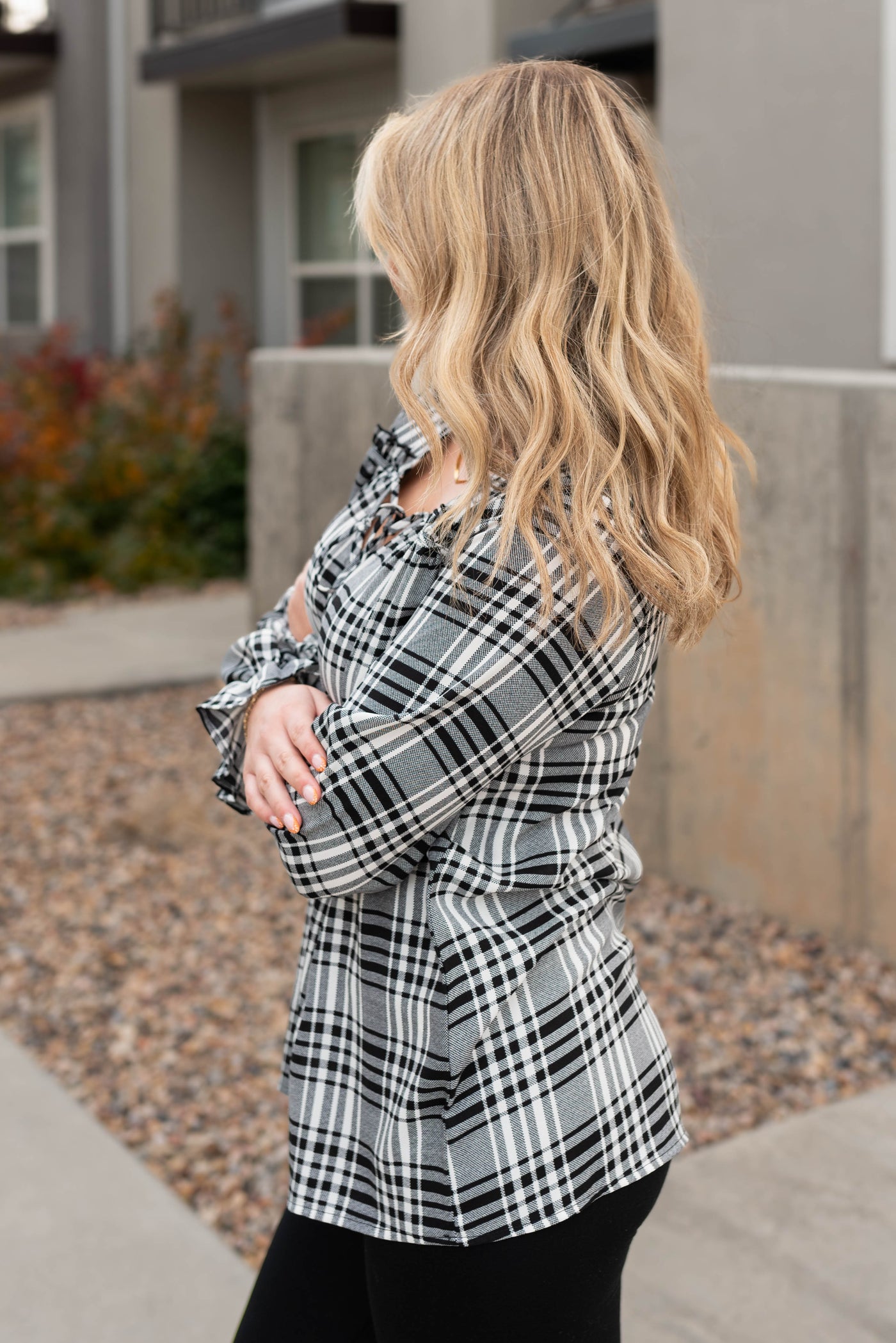 Side view of the black plaid blouse