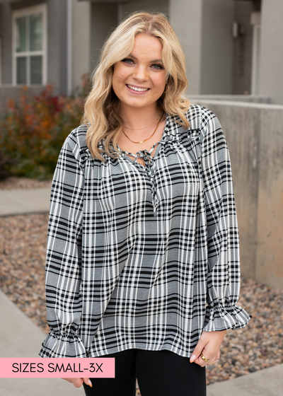 Long sleeve black plaid blouse that ties at the neck