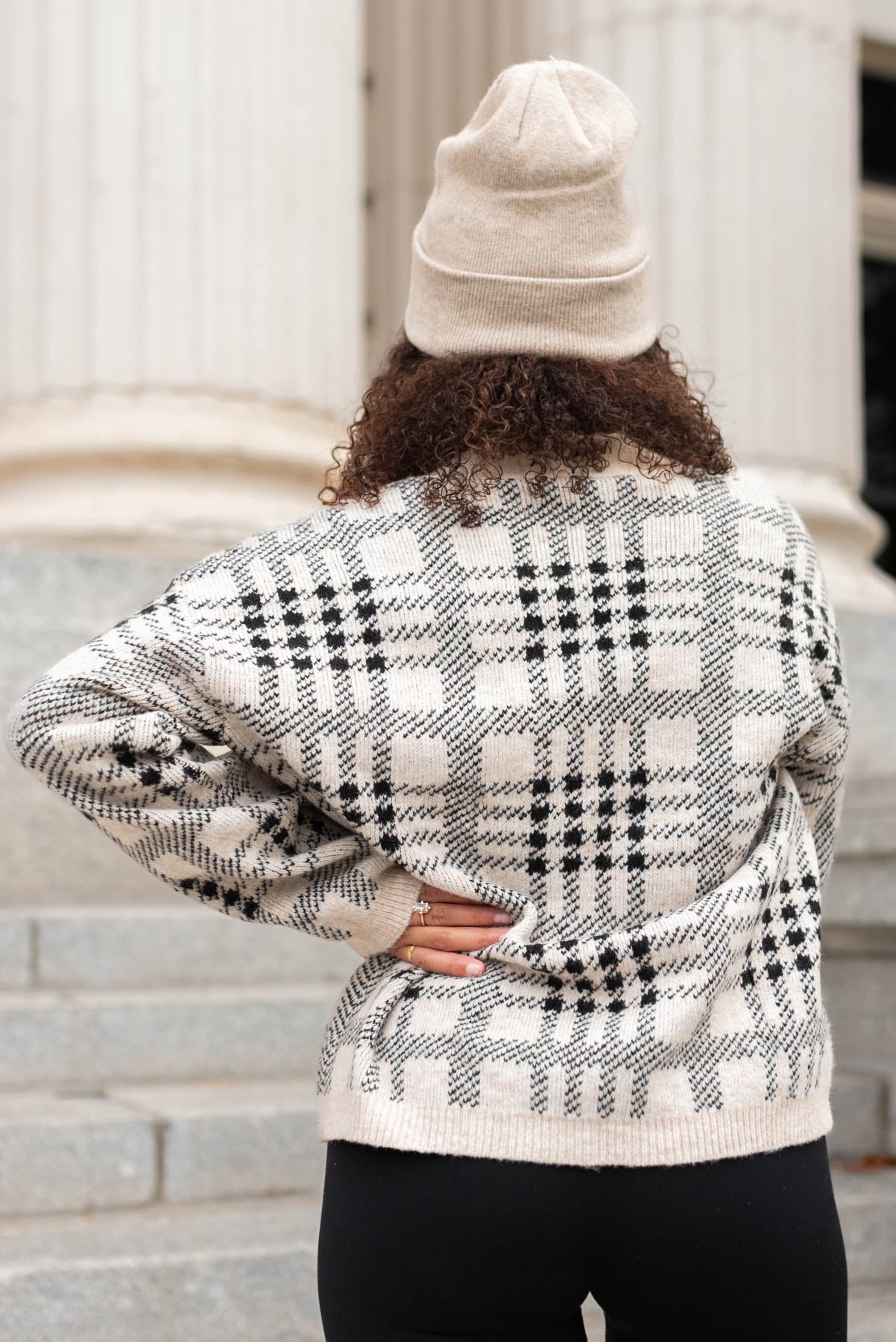 Back view of a taupe button down cardigan